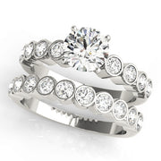 ENGAGEMENT RINGS SINGLE ROW BEZEL SET